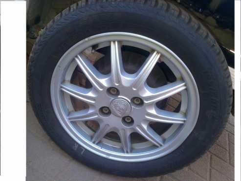 100pcd 4stud 15inch proton mags with new tyres swop or sell