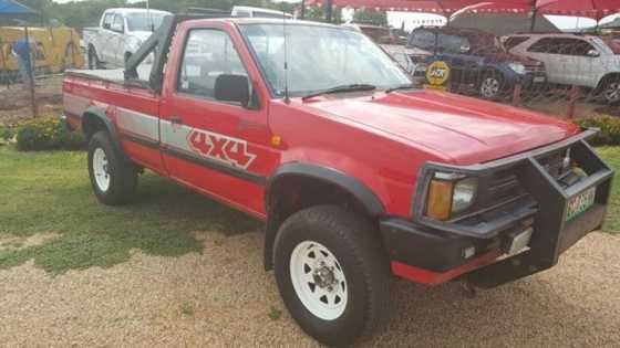 1991 Red Nissan 2.4 4x4 SC Lwb