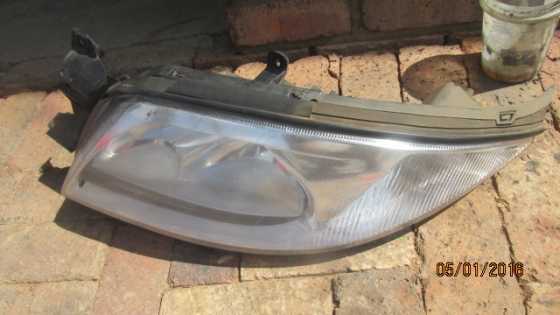 1999 Ford Fairmont left headlight