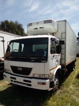 2010 NISSAN UD90 WITH A FRIDGE BODY FOR SALE