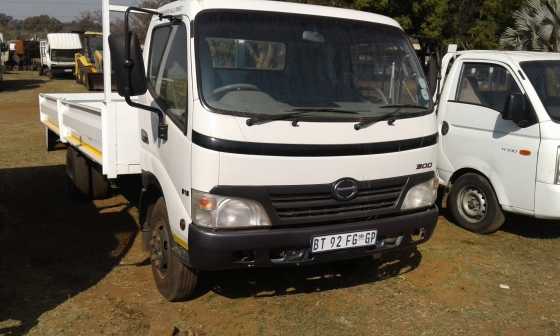 2012 Hino 300 915 with Dropside Body