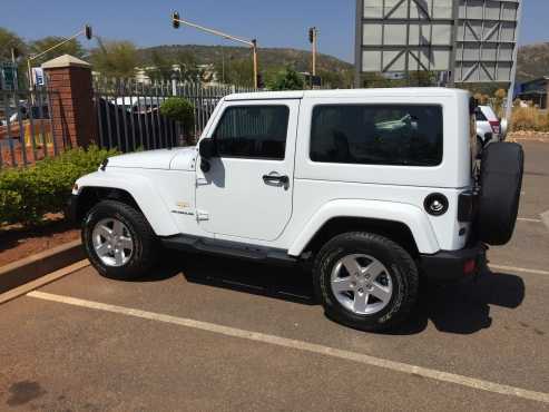 2015 White Jeep Wrangler Sahara. 4x4. Automatic. 2 door.