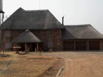 2.2 ha with Double storey, thatched roof house