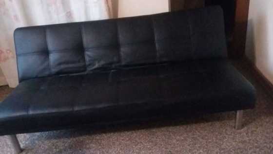 2x black leather sleeper couches