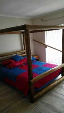 4 post Gum pole bed. Queen size in perfect condition.