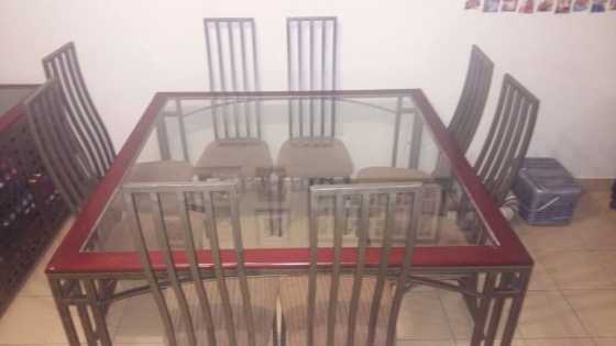 8 seater glasstop diningroom table and buffet