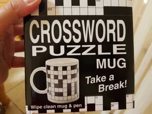 A crossword puzzle on a mug