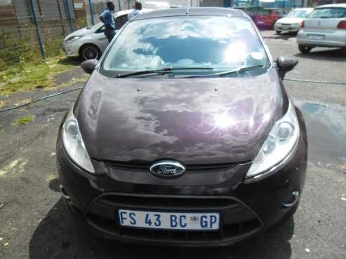 A ford fiesta 1.6 sport, 2010 model, factory ac cd player, central locking, purple in color, 96000