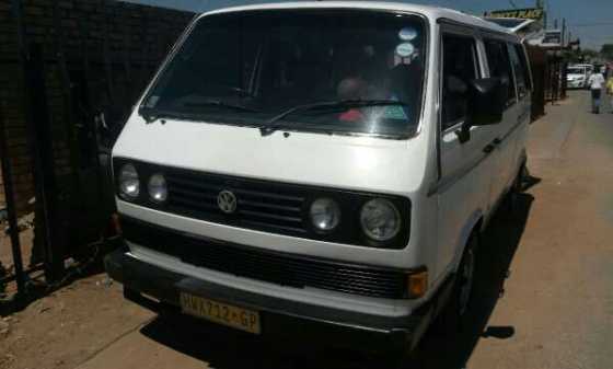 A white Microbus with nine seater. perfect for family and to travel a long distance.