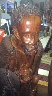 African statue of man with pipe