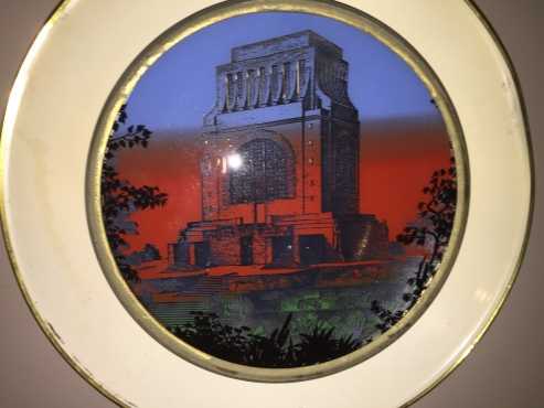 Antique wall hanging back ground light with voortrekker monument front visor.