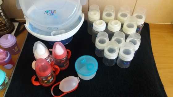 Avent microwave stariliser with 12 Avent bottles for sale