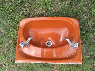 Basin with taps