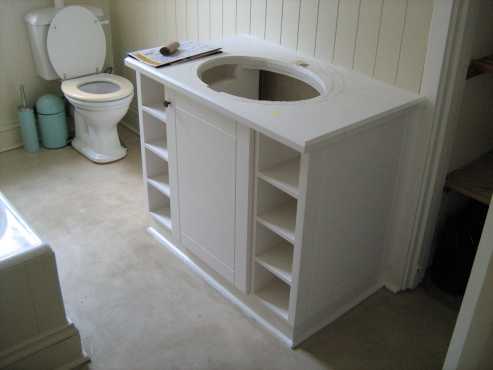 bathroom-White Bathroom Vanity with Cotto Basin and Mixers.