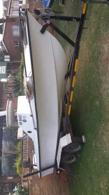 Boat on double axle trailer without motors