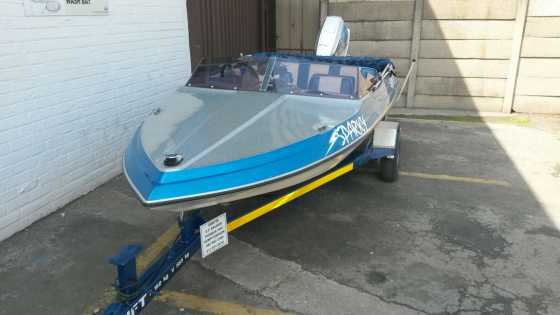 Boat with canopy, trailer and cover