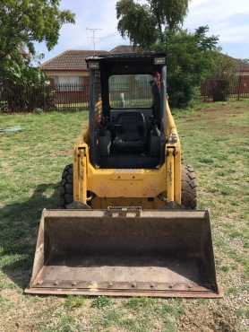 Bobcat  Skidsteer for sale Komatsu SK714 with its trailer