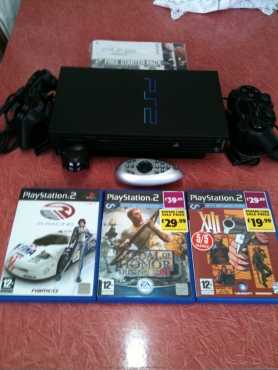 Brand new Sony PlayStation 2 with extras.