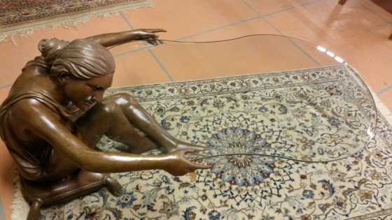 Bronze woman with glass table