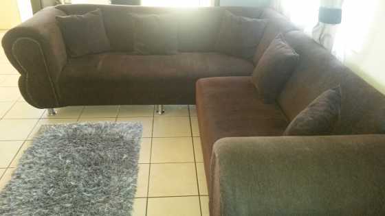 Brown L shape corner lounge suite