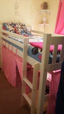 Bunk bed with doll house play area at the bottom