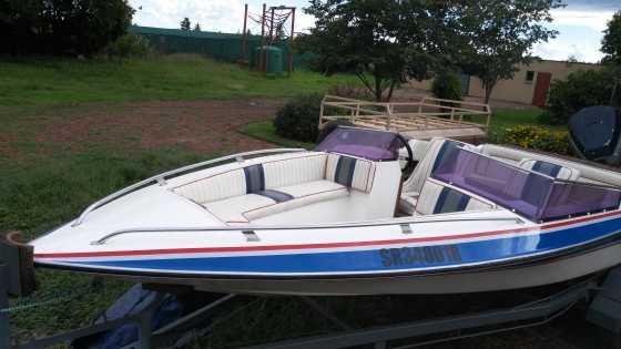 Cabin boat like new must be seen with 90 hp Mariner.