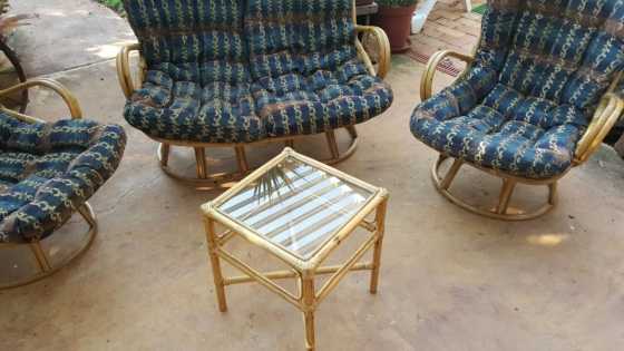 Cane 4 seater set plus side table.excellent condition