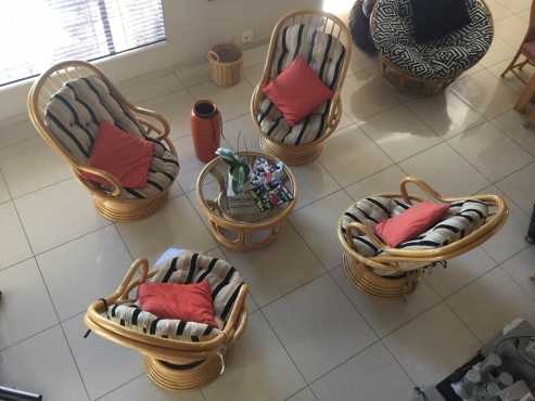 Cane swivel rockers and cane coffee table