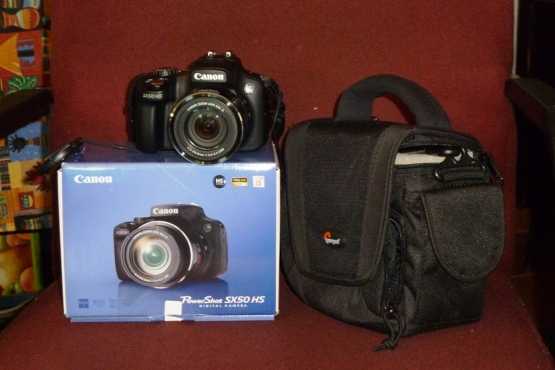 Canon SX50HS camera with 24-1200 mm lens bundle. New with warranty.