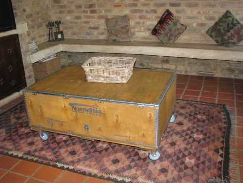 Coffee table  chest with wheels.