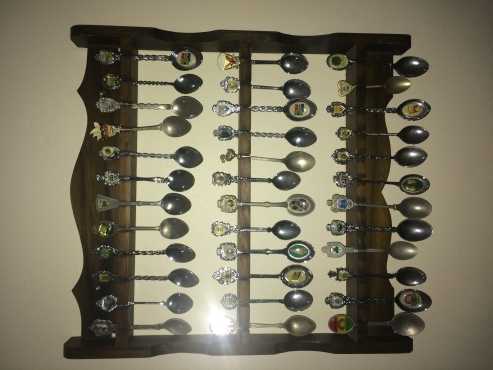 collection of 219 souvenir teaspoons with handmade wooden racks