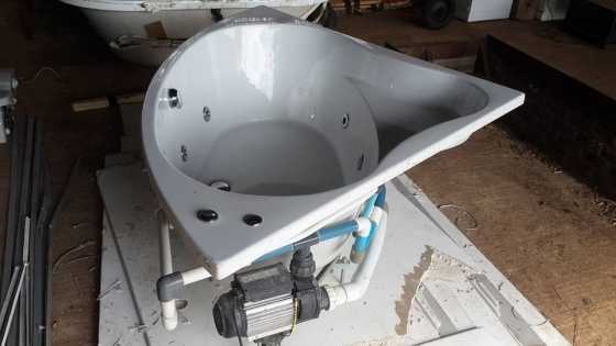 Corner spa bath with motor and plumbing for sale