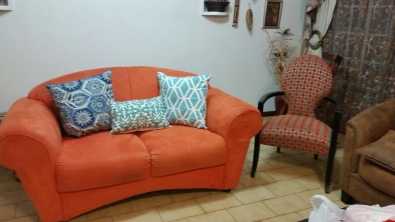 Couch orange 2 seater. width 85 cm length 1.80cm