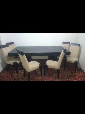 Dark stained diningroom table with 6 Highback chairs