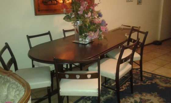 Dark wood fold-in Dining Room Table, chairs and Side Board