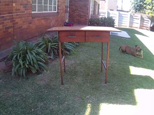 Desk with wooden top and iron legs