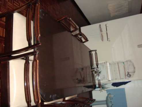 Dining room table with 10 chairs plus side cabinet