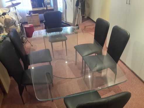 Dining Set. 7 Piece beautiful leatherette chairs and glass table.