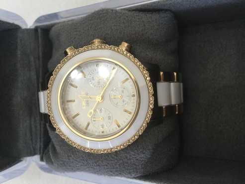 DKNY women watch Gold-tone White Ceramic. New new still have plastic on.