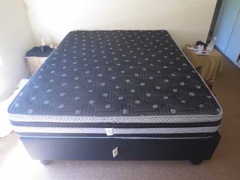 Double bed base with mattress and protection cover