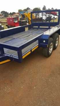 Doule axle trailer new with papers can load a bobcat on it