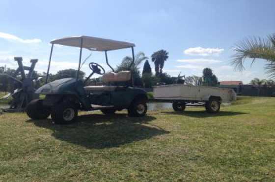 Ez-Go Petrol golf cart with trailer for a farm