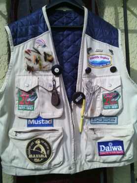 Fly-fishing vest with cap