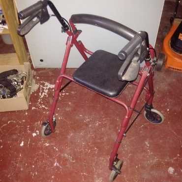 Frail Care Walker with a seat and 4 wheels