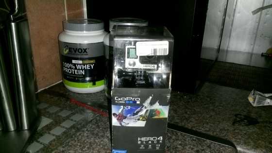 GoPro Hero 4 black in packaging with multiple accessories