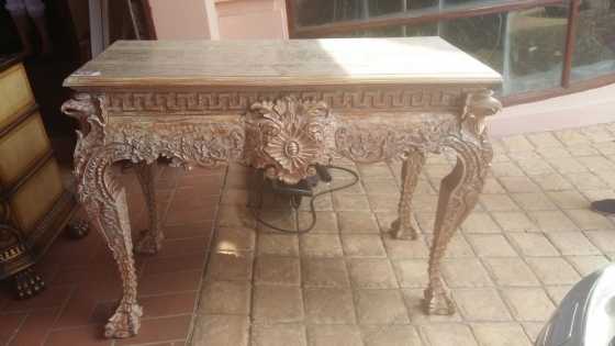 Hand carved ornate wooden table wpaint finish. Excellent condition