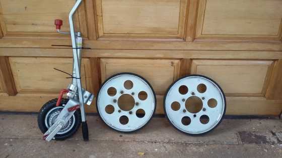 Height reducing wheels and ratchet dolly