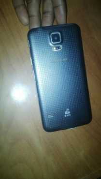 In Box, in mint condition Blue LTE Samsung Galaxy S5 with earphones, USB cable amp charger included...