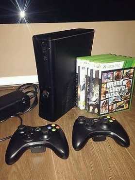 In BOX, in mint condition Xbox 360 Slimline 320gb with 5 games amp 2 original controllers for sale...