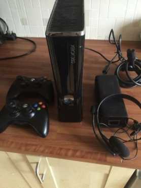 In great condition Xbox 360 Matt Black Slimline with Original Game amp 2 Wireless Controllers included